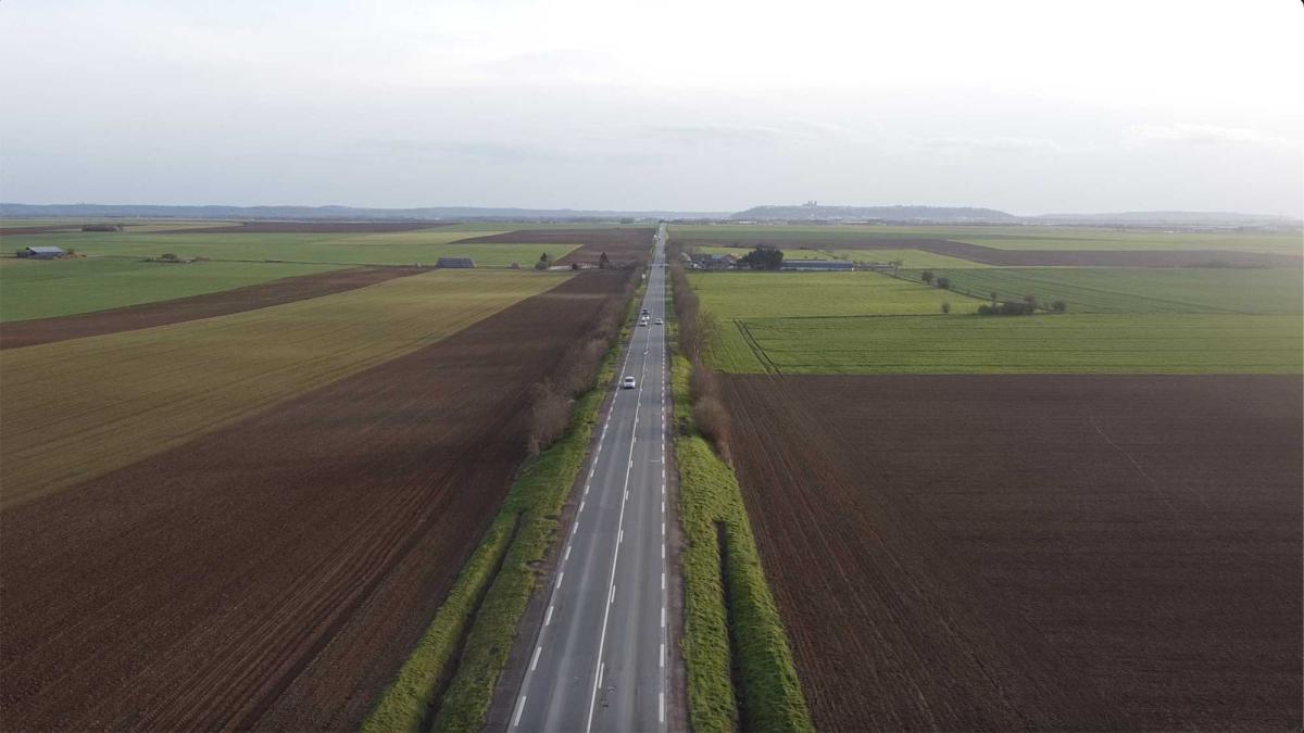Drone shot of a road and farms in France