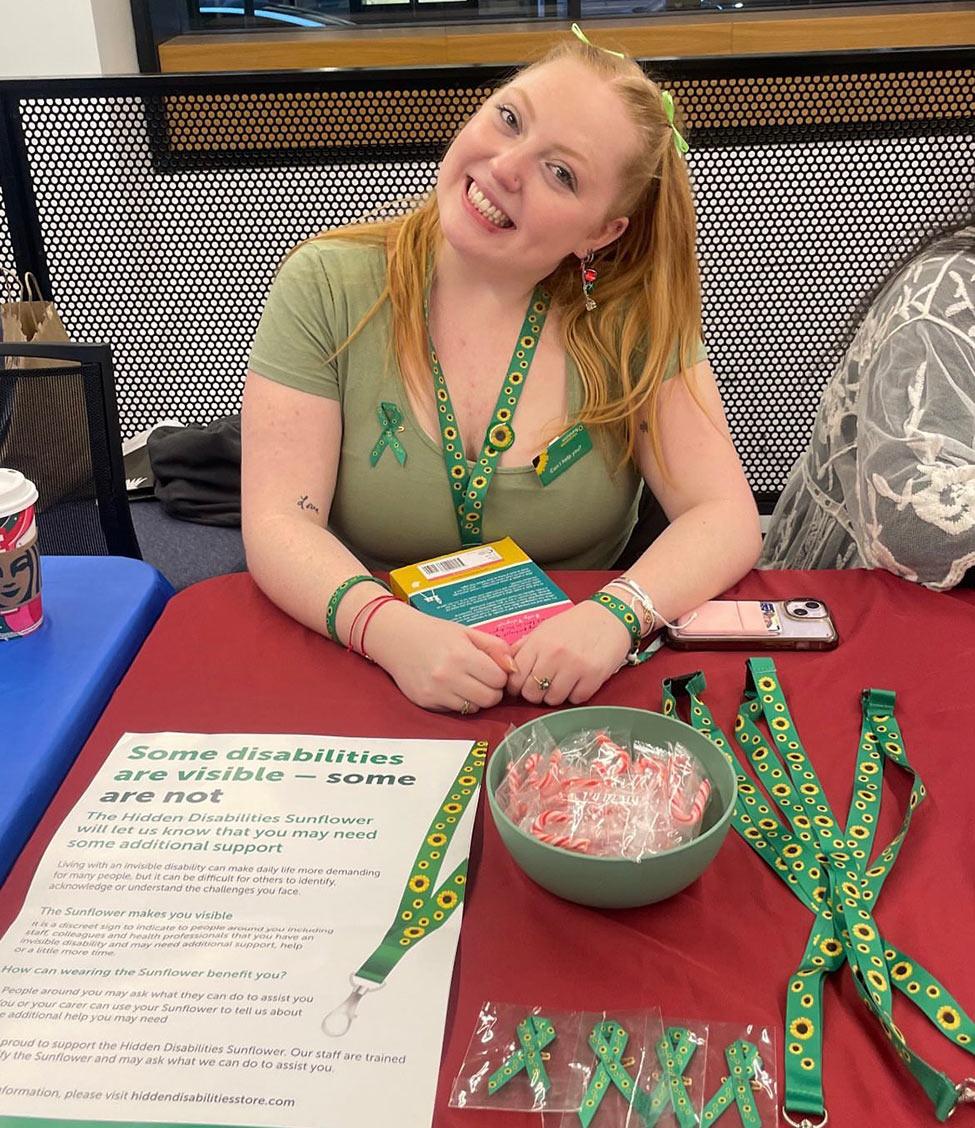Pace University student, Lucie Flagg wearing her sunflower lanyard