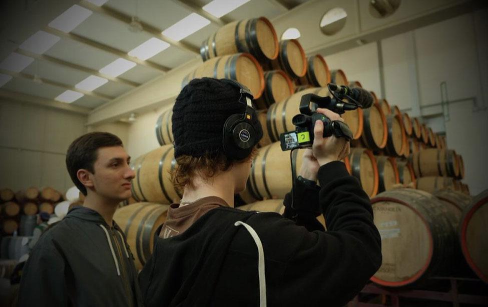 students filming in barrels. 