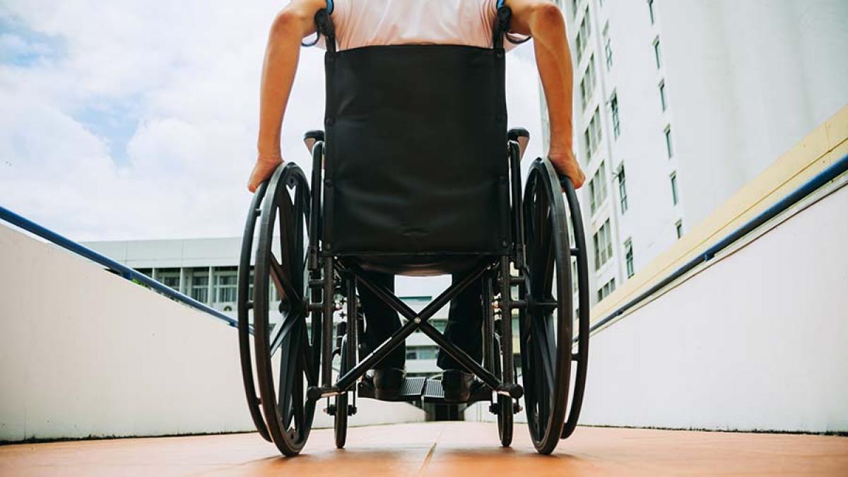 wheelchair user on hotel path