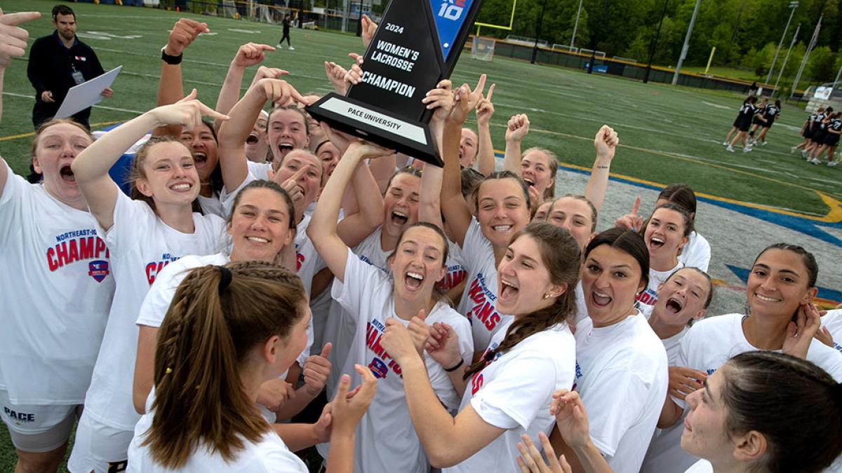 The Pace University Women's Lacrosse team celebrating their Northeast 10 conference championship.