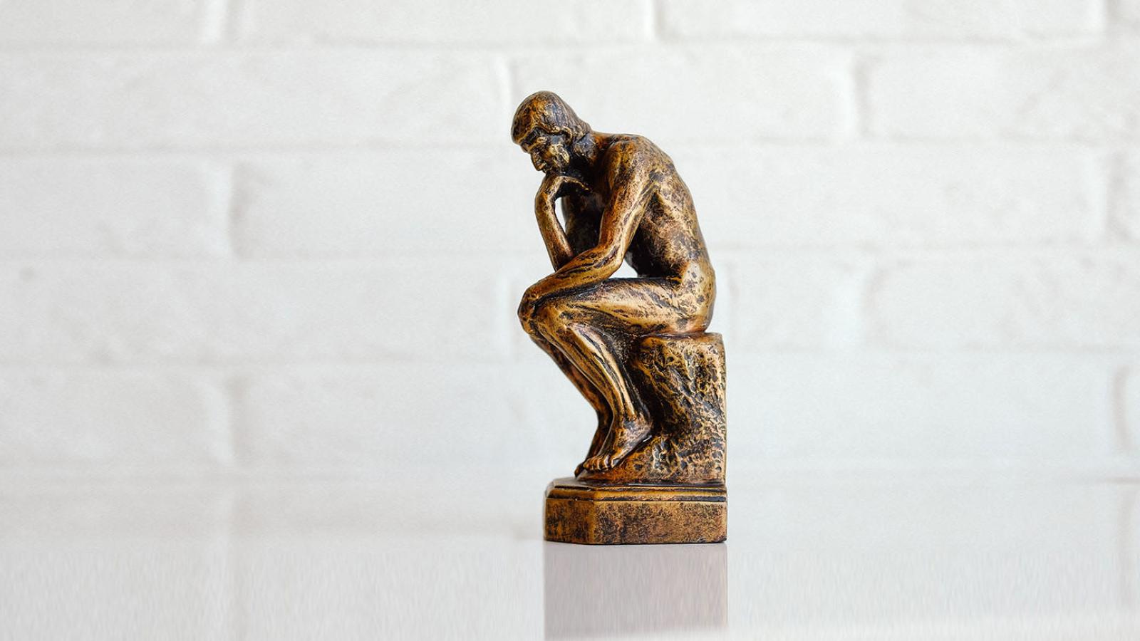 Thinking man statue in bronze
