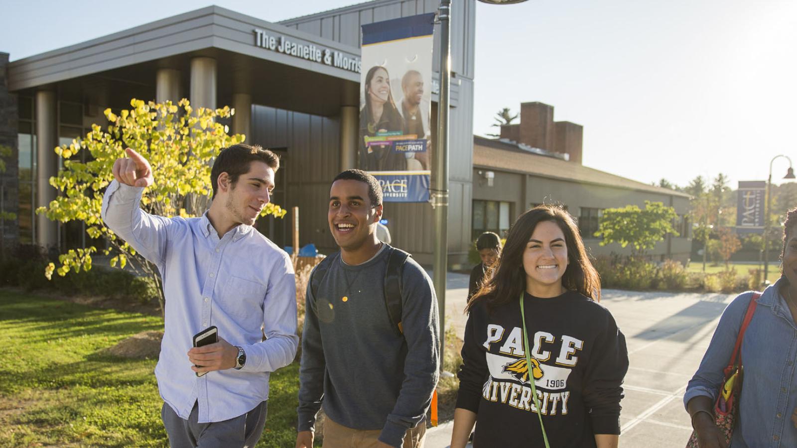 three Pace University students walking on the Pleasantville Campus in Westchester