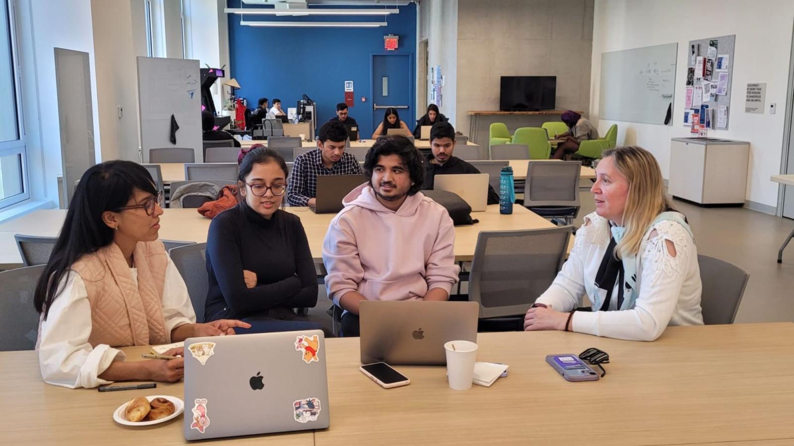 Pace professor Dr. Christelle Scharff mentoring a group of students for the NY Climate Exchange AI Innovation Challenge in the Seidenberg Design Factory. 