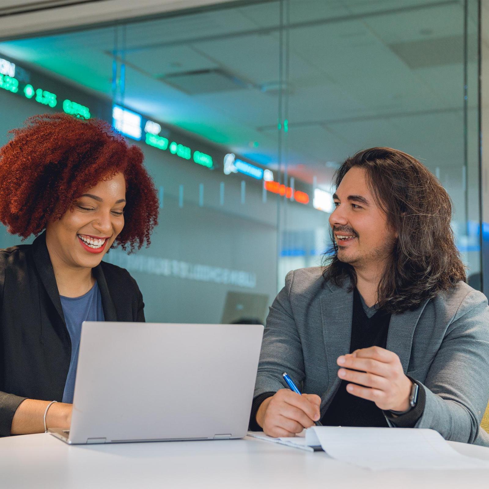 Two graduate students in a discussion