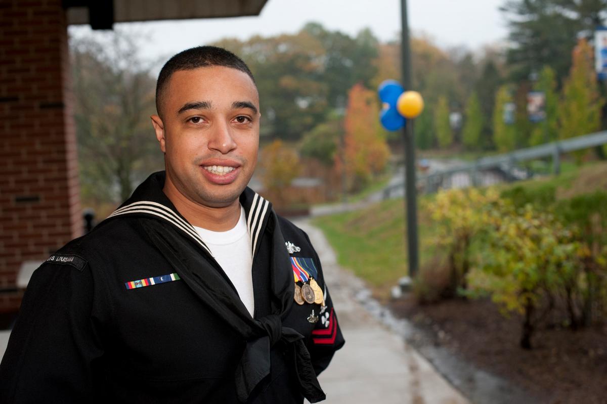 Veteran student smiling for the camera at the Westchester campus.