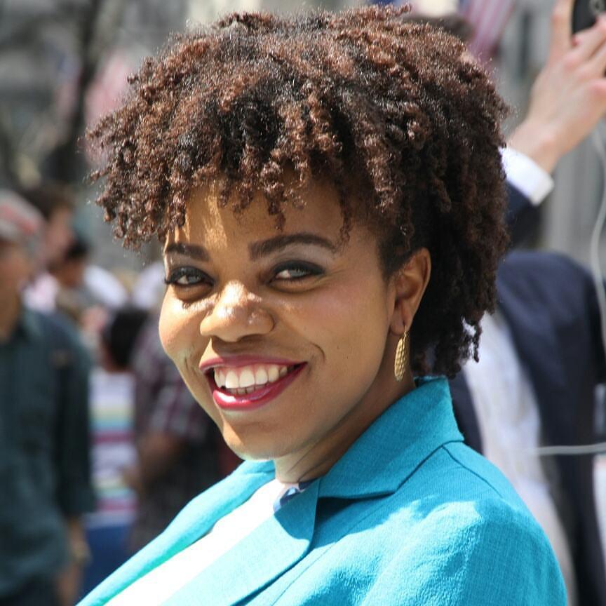 smiling woman in a blue blazer