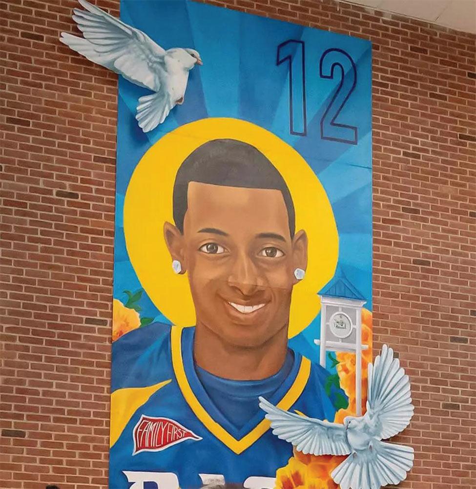 mural of dj henry on a brick wall