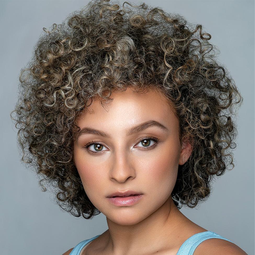 woman looking at camera with gray background