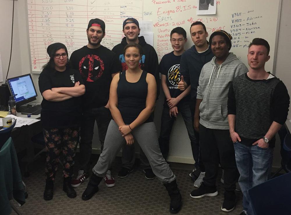 Group of Seidenberg students smiling at the camera.