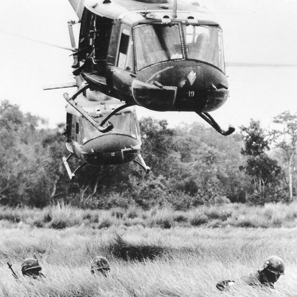 black and white photo of helicopters landing