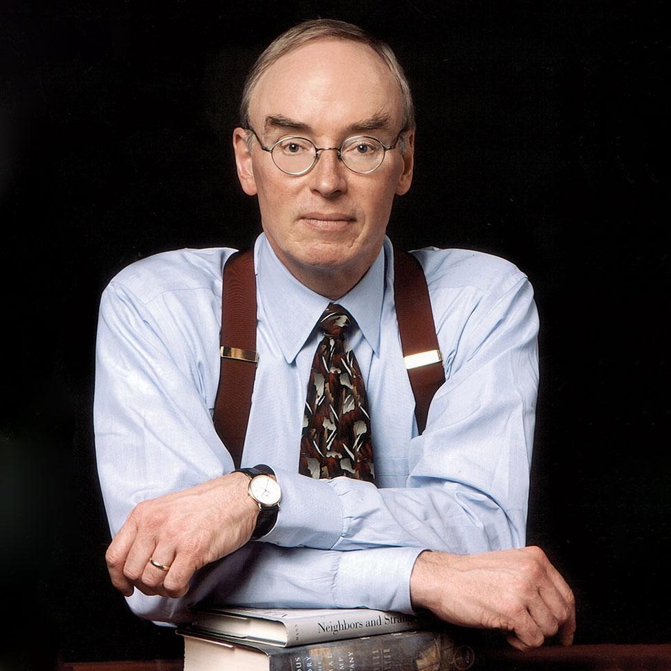 portrait of a man in suspenders posing for camera