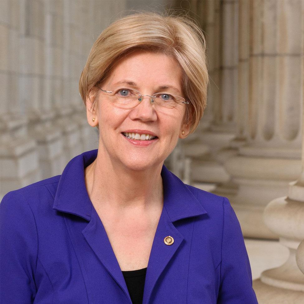 portrait of a woman in a blue suit posing for the camera