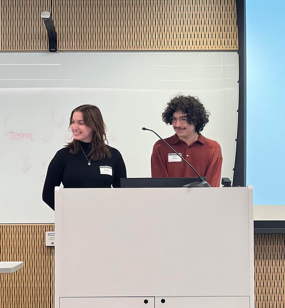 Pace University students Kalina Walaski and Dante Dallago at a podium