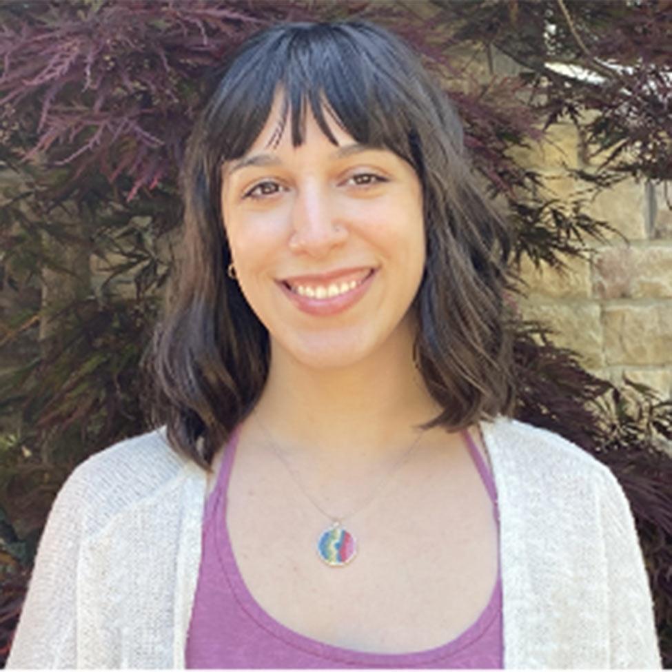 Portrait of Julia Corrado wearing a magenta tank top with a white shawl