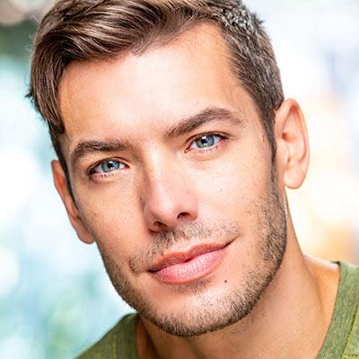 Portrait of Brandon Leffler wearing a green shirt