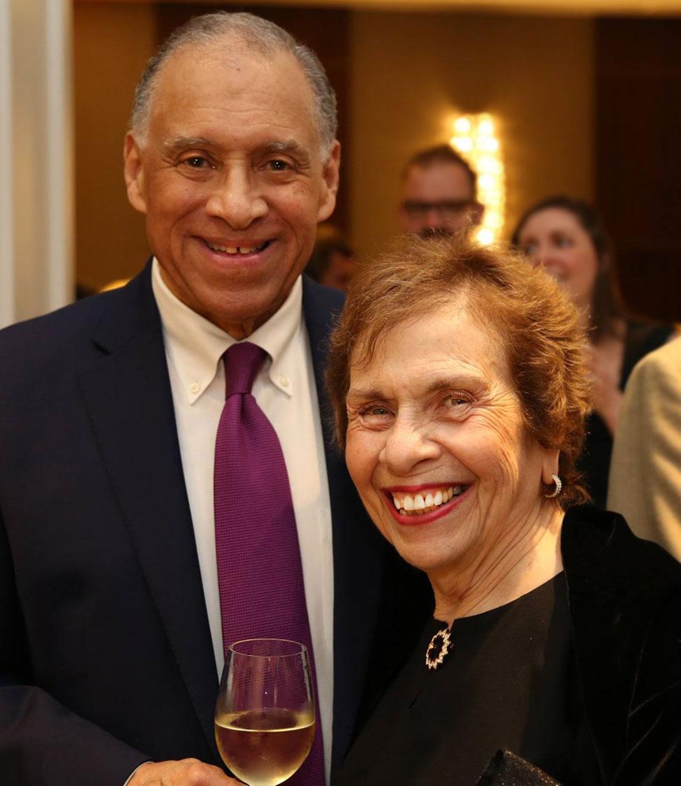 marilyn jaffe-ruiz and her husband victor pose for the camera