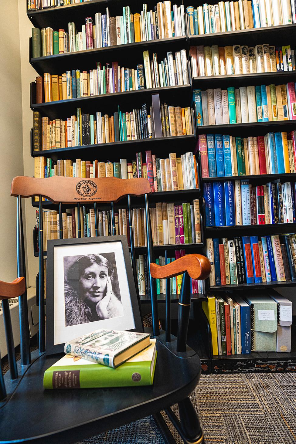 A portrait of Virginia Woolf with some of her books in the Virgina Woolf collection library