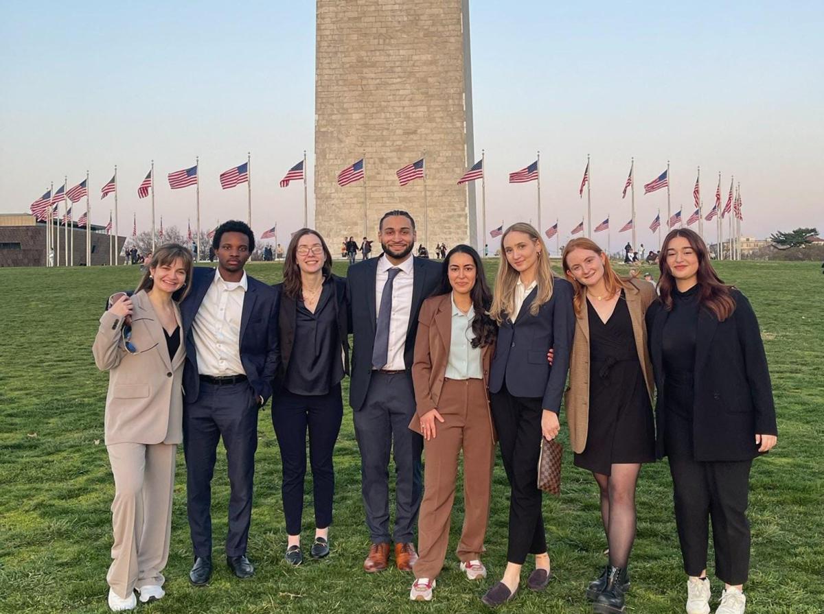 Group of Pace University economics students on the Fiscal Challenge Team standing in front of the Washington Monument