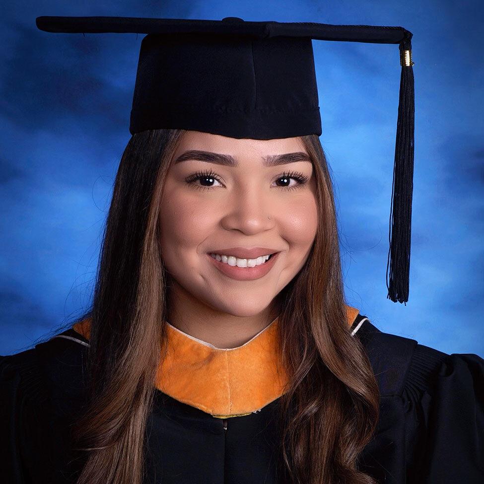 Alum Sindy Beato in cap and gown.