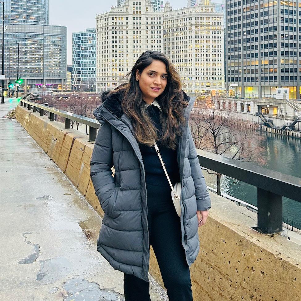 Pace University student Fiemmi Gonsalves standing next to a body of water