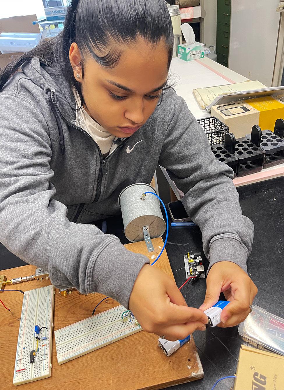 One of Pace University's Mathematics professor Analee Miranda's students working with circuits