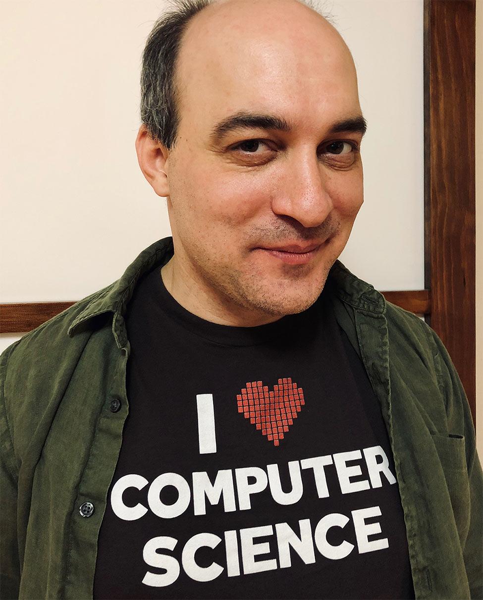 Carmine Guida wears a shirt that says I Heart Computer Science