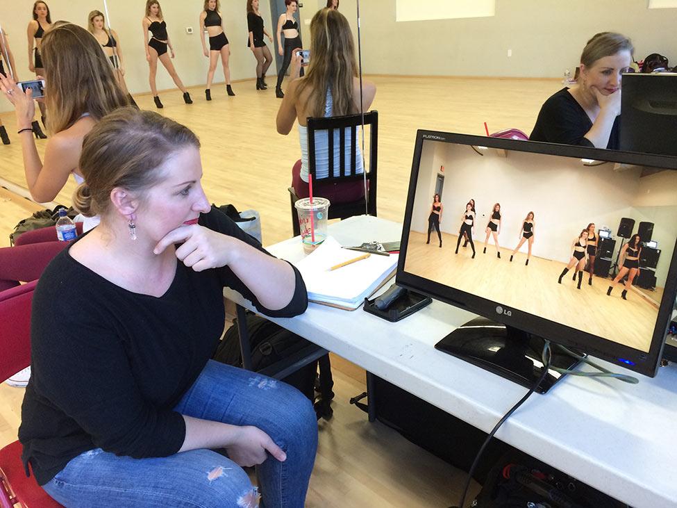 choreographer Mandy Moore reviews footage of Pace Commercial Dance students in an LA studio