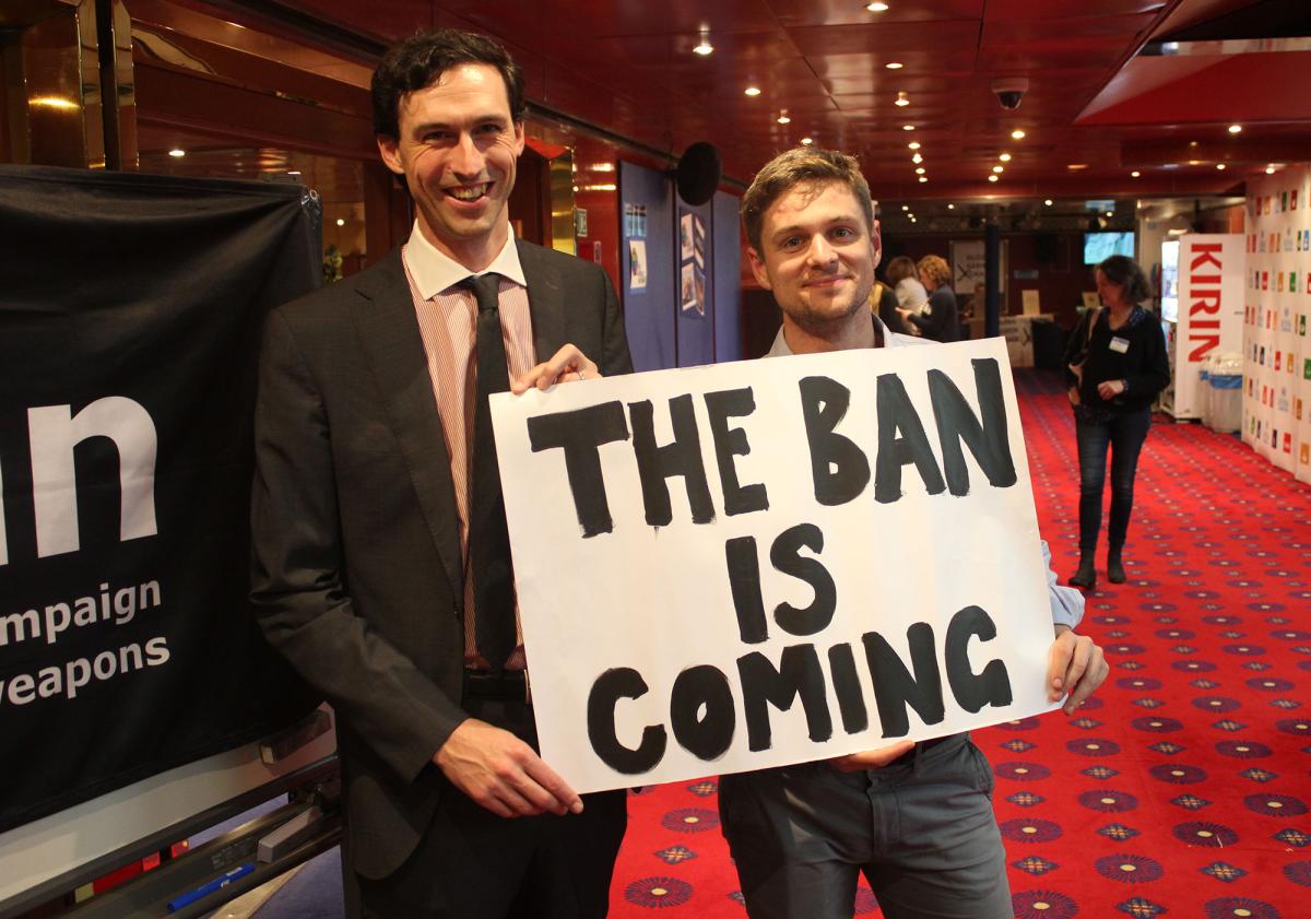 Pace University's faculty member Matthew Bolton, PhD, and Daniel Högsta, Deputy Director of ICAN holding a sign stating "The Ban is Coming"
