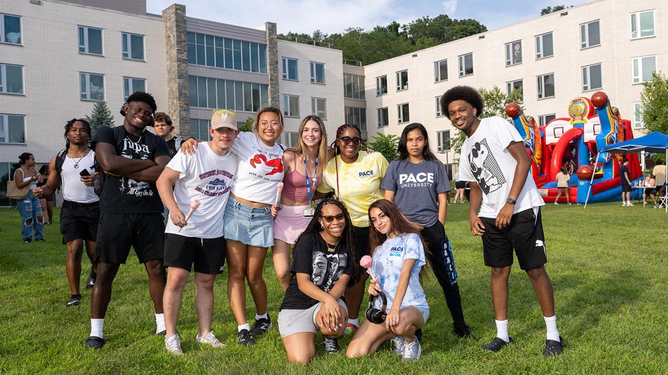 Pace students posing for a photo on Alumni Lawn.