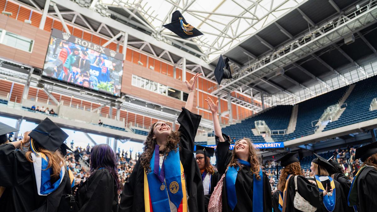 Pace University graduate students celebrating their Commencement.