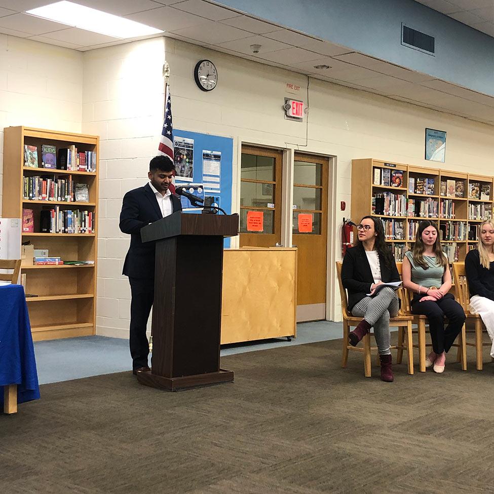 College of Health Professions PA student Azeem Azhara giving key note speech at honors society induction.