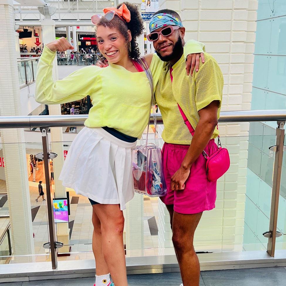 Melvin Williams and his friend pose in their Barbie-inspired outfits