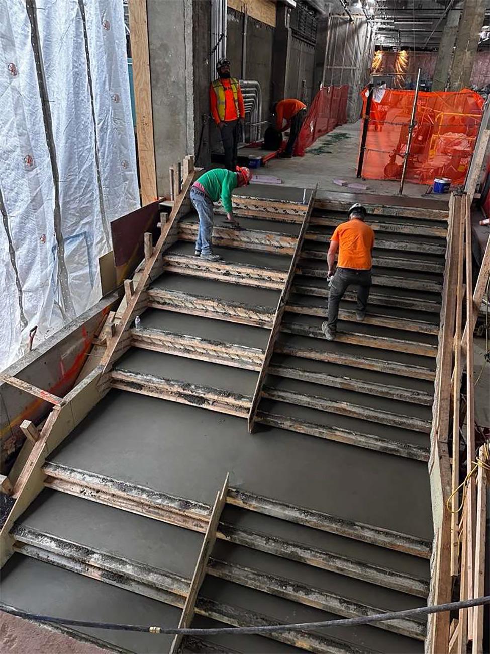 Pouring concrete in to the new stair feature.