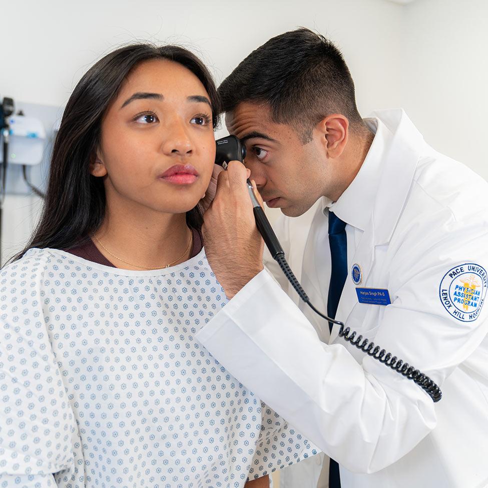 Pace University Physician Assistant student practices in the simulation lab.