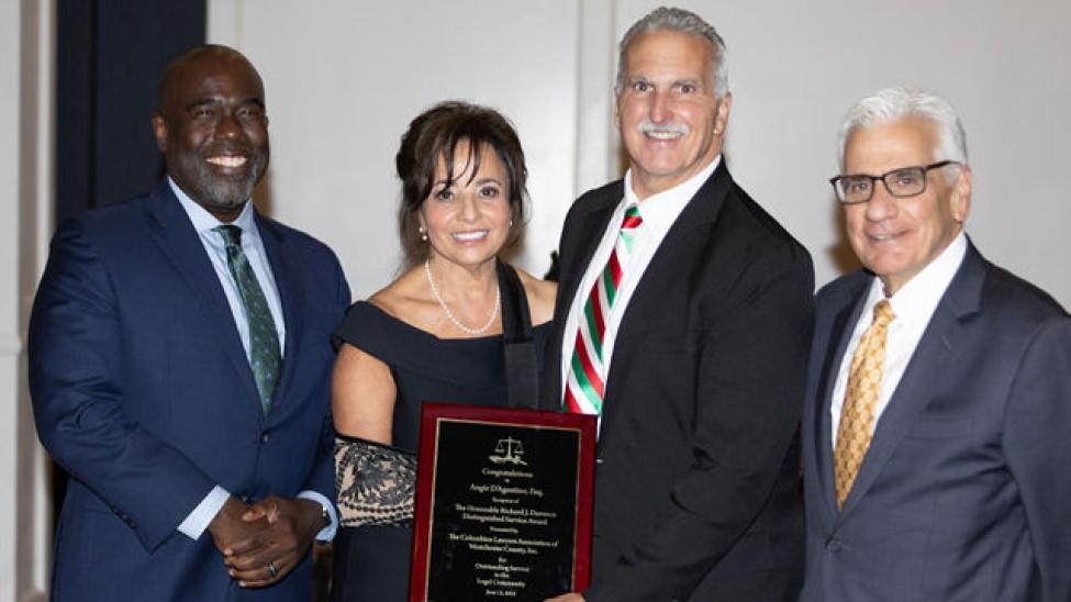 Elisabeth Haub School of Law at Pace University Dean Horace Anderson with Angie D'Agostino holding award