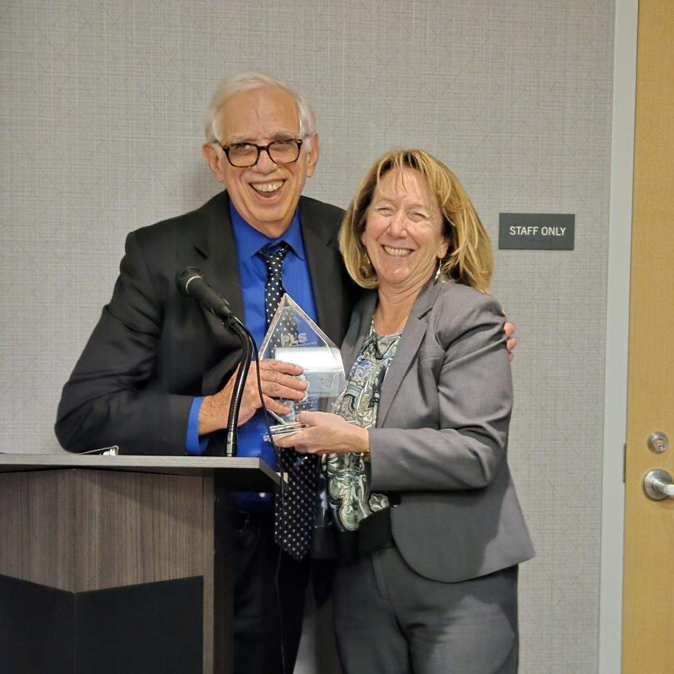 Elisabeth Haub School of Law at Pace University Professor Emeritus Michael Mushlin receiving the John R. Dunne Chamption of Justice Award