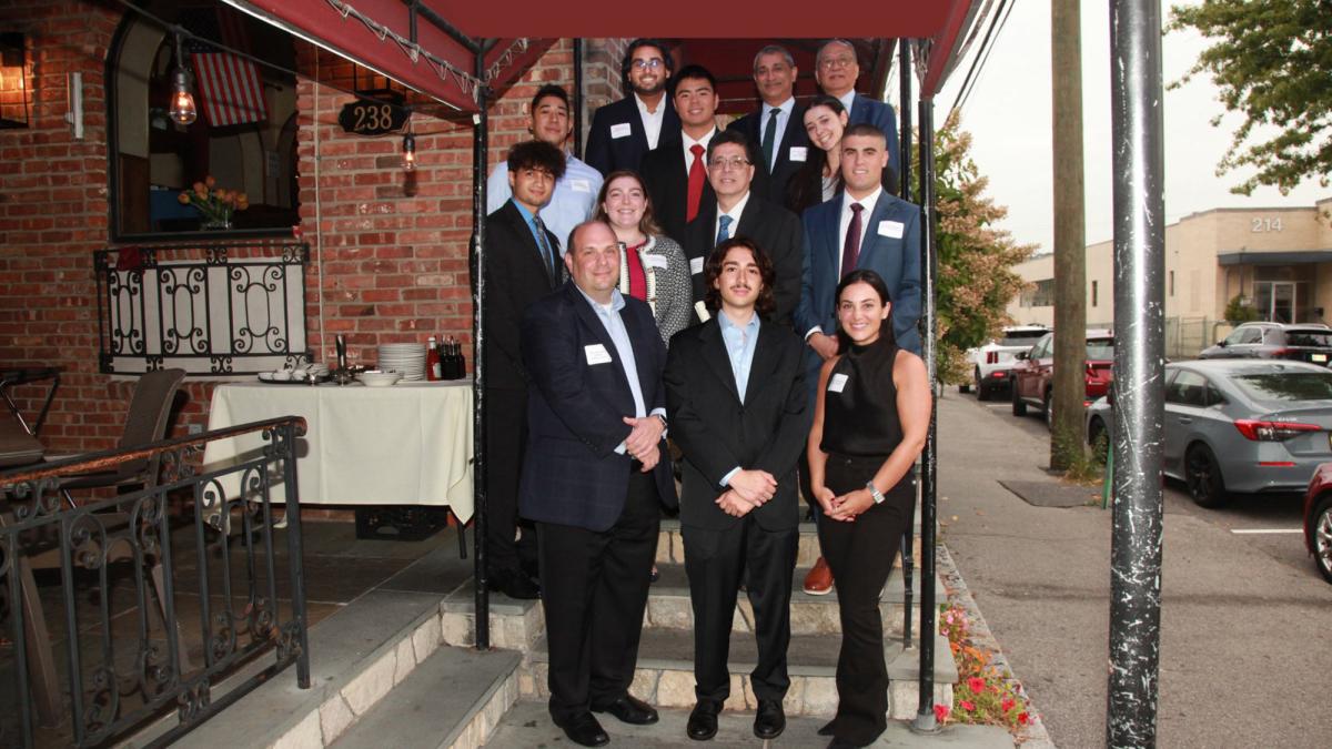 Lubin School of Business EY Scholarship recipients with Ernst & Young representatives and Lubin faculty at the scholarship reception dinner.