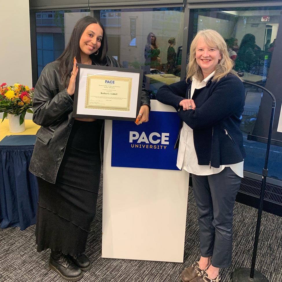 Pace University faculty member Sid Ray alongside one of her students