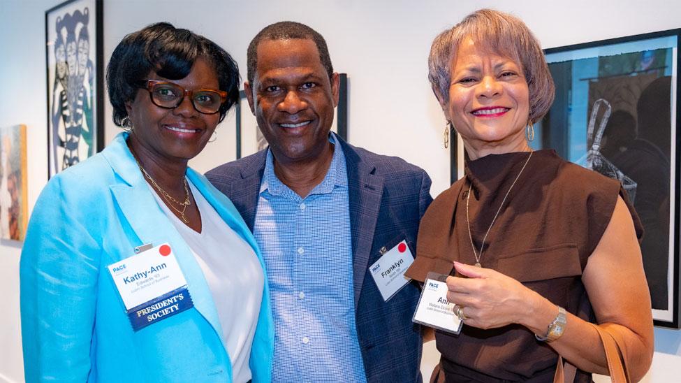 Kathy-Ann Edwards and Franklyn Smith posing with another Pace alumna.