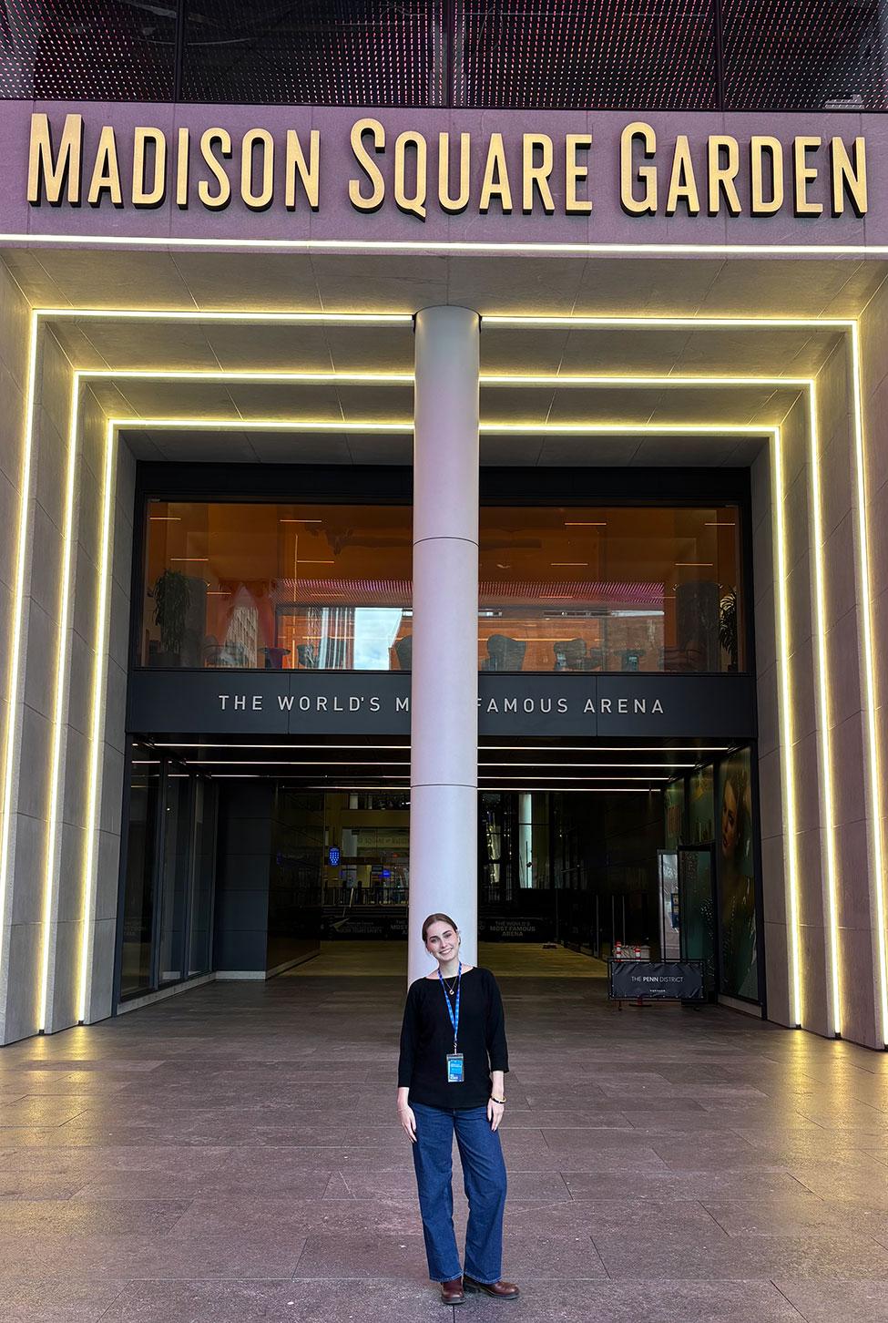 Pace University Art and Communications and Media Studies student Olivia Vella standing in front of Madison Square Garden