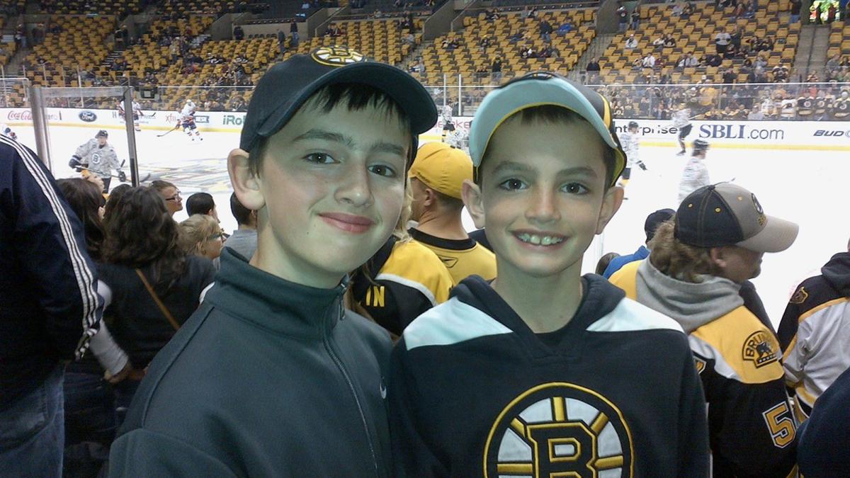 Pace University Lubin School alumnus Henry Richard ’25 and his brother Martin Richard at a hockey game.