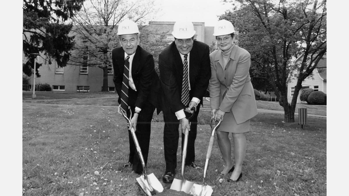 Pace president Ewers and others wear hard hats at the Haub Law groundbreaking