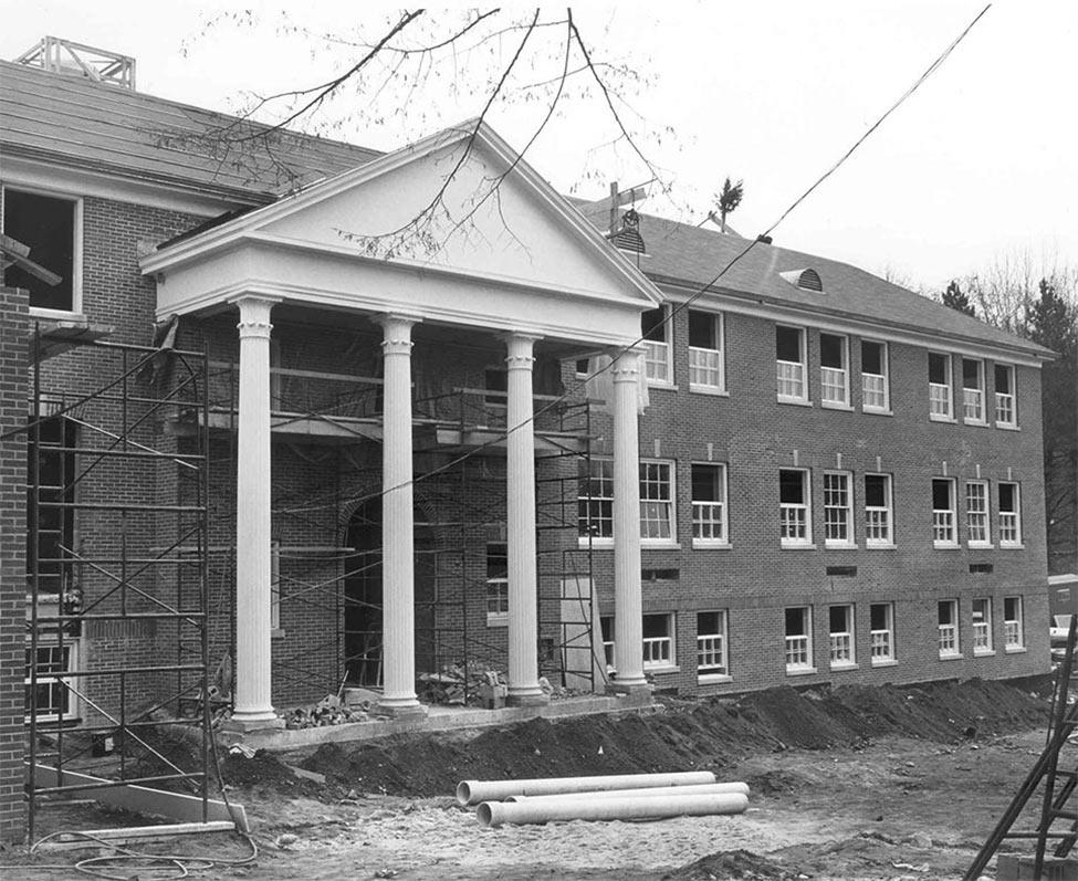 A black and white archival photo of the construction of Willcox Hall