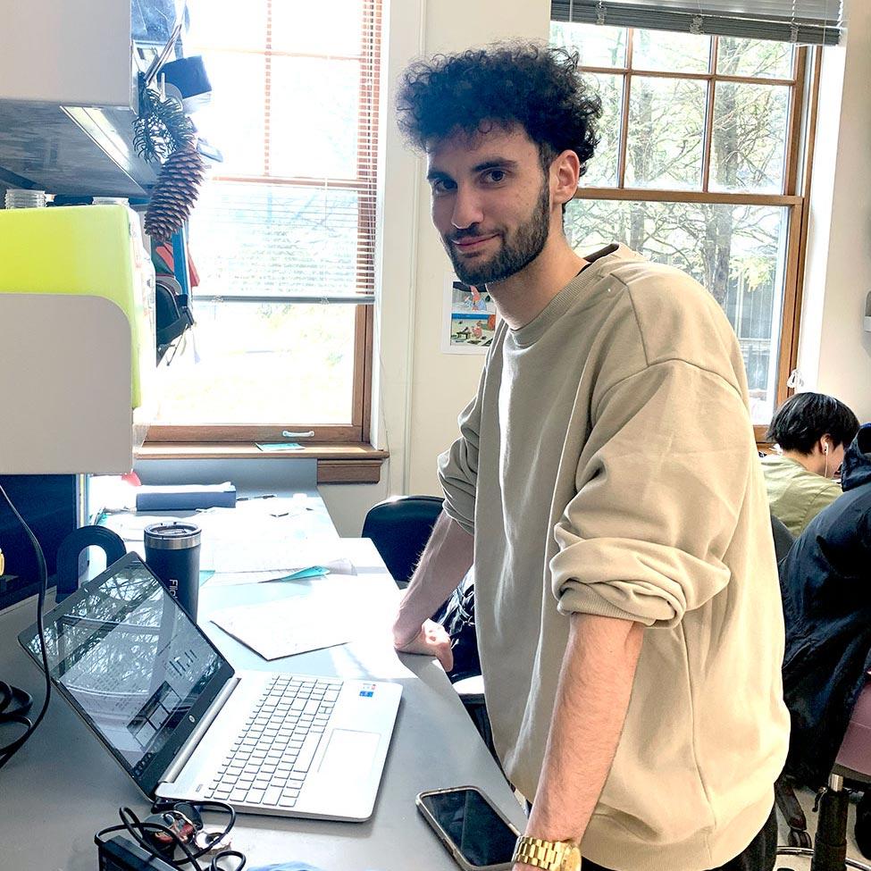 Pace University's Biology student Michael Ferretti doing research on a laptop