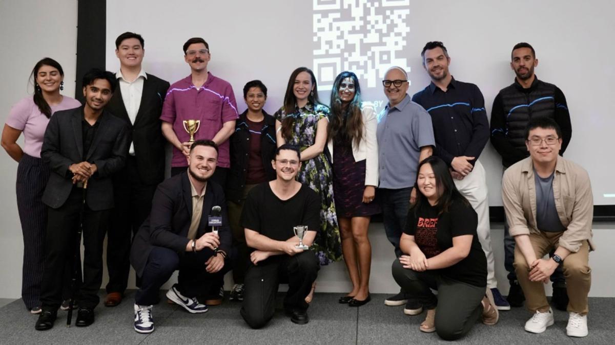 Group of students and mentors posing with awards at event