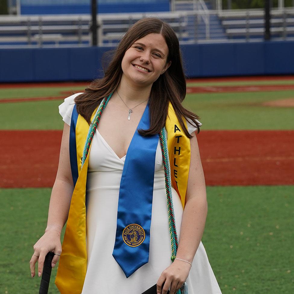 Pace University Behavioral Neurosience student Morgan Strecker in a Pace athletics field.