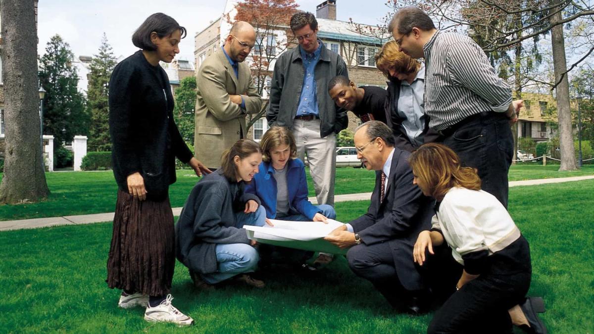 Haub Law Professor John Nolon with students reading a paper