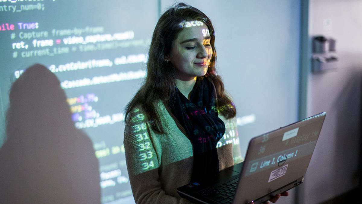 Female student taking a coding class.