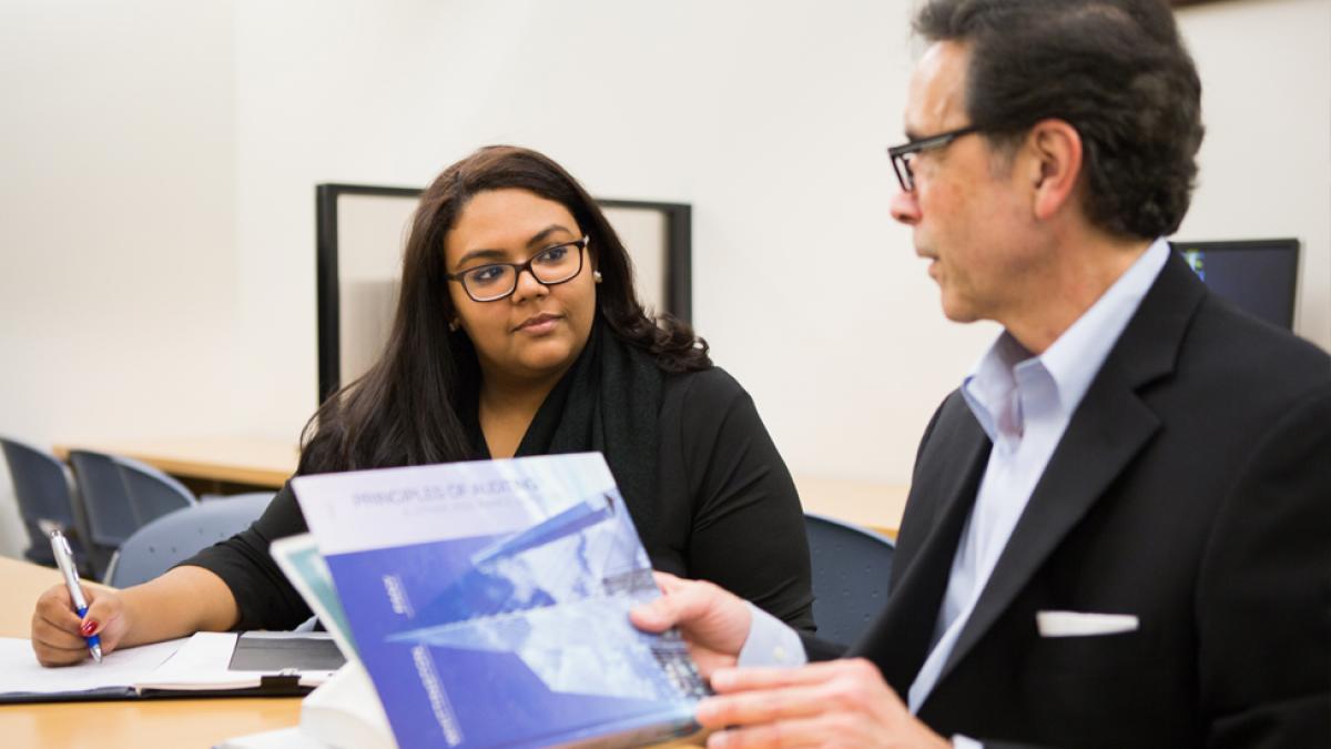 Student being advised by a faculty member.